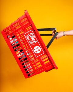 Red shopping basket full of meals.