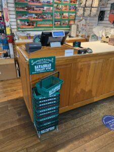 Stack of green shopping baskets.