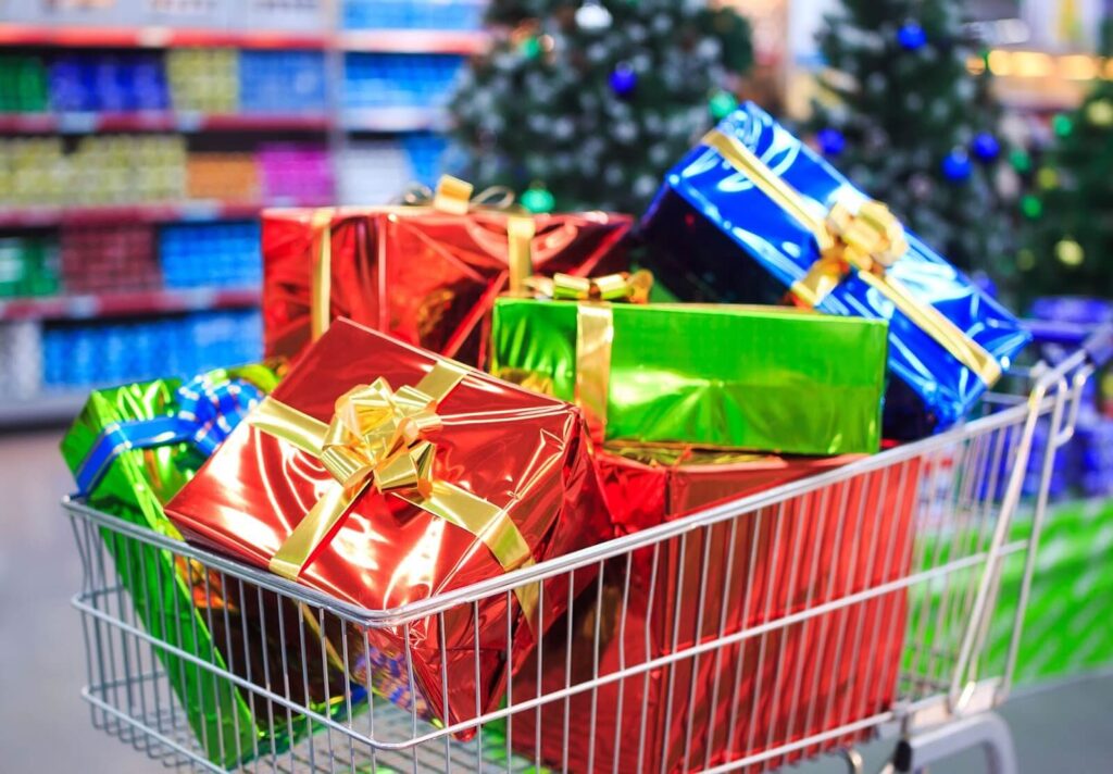 A shopping basket filled with wrapped gifts