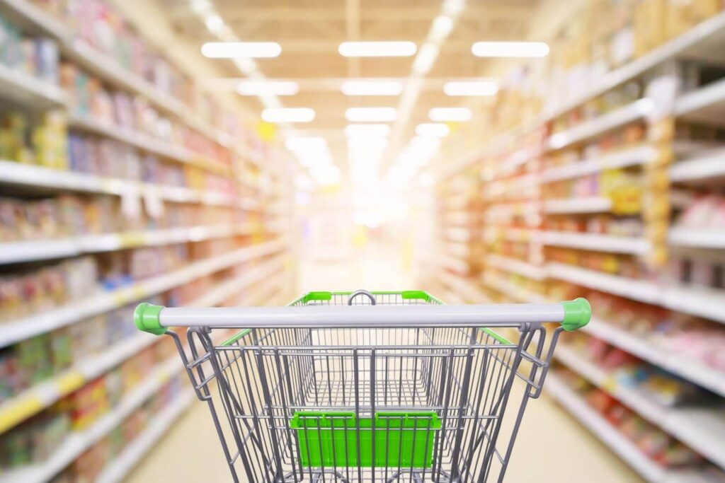 An empty shopping cart in a grocery store