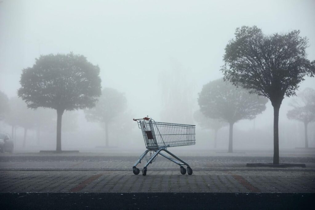 Shopping cart full of school supplies.