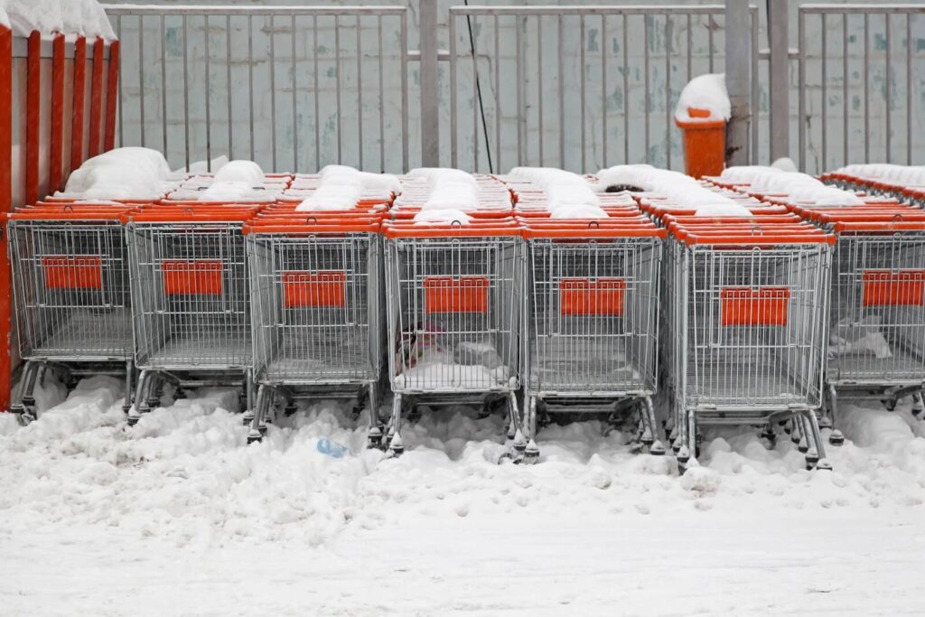 Rows of shopping carts outside.
