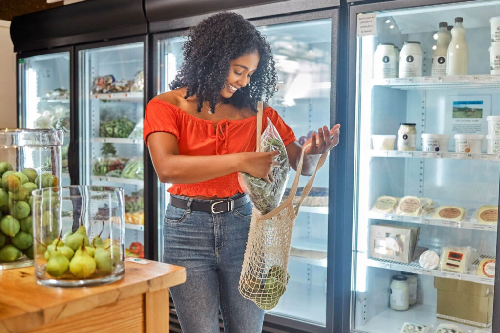 Woman using a reusable shopping bag.