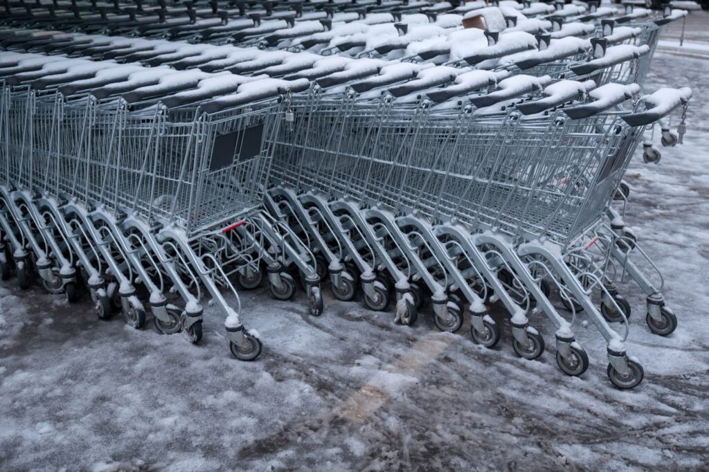 Line of steel shopping carts in winter