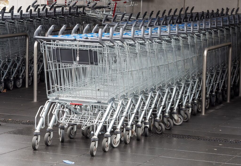 Line of wire shopping carts outside of a store
