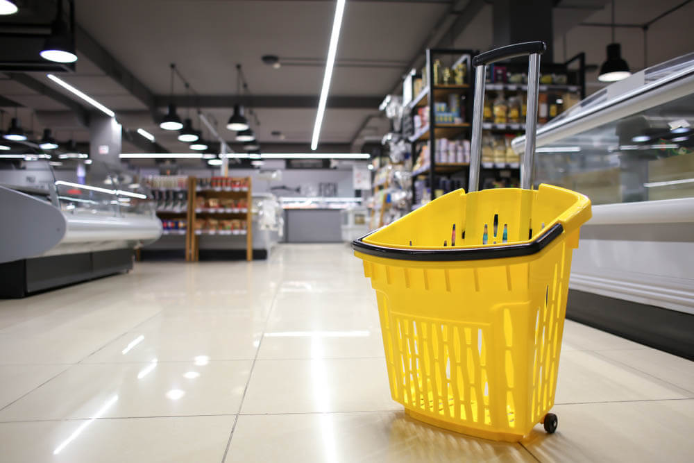 Yellow rolling cart in a grocery store
