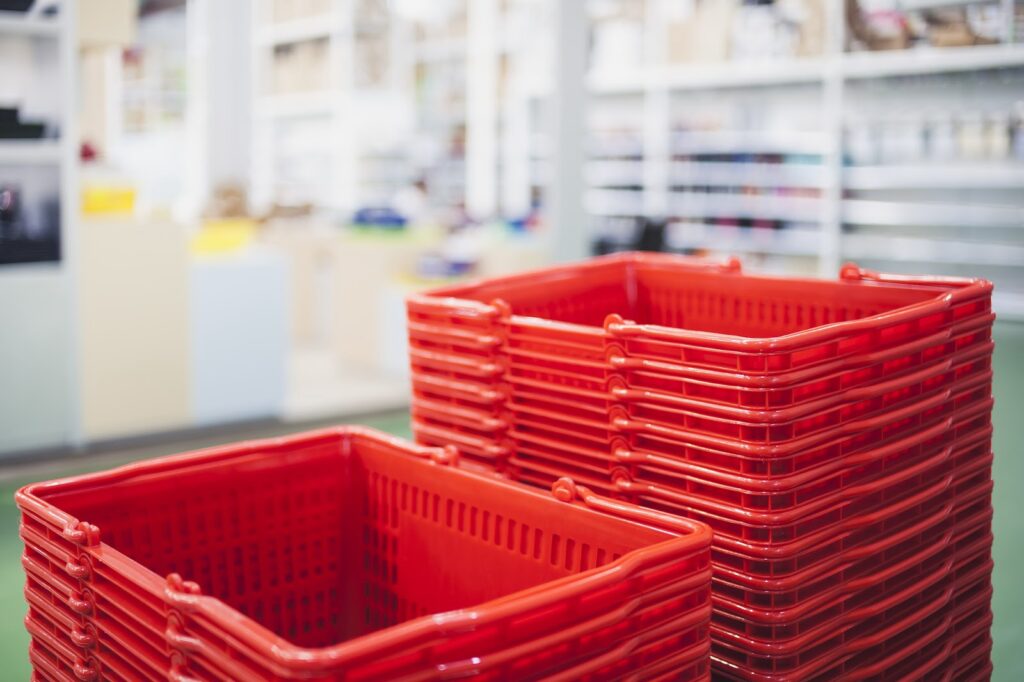 Stack of red shopping baskets