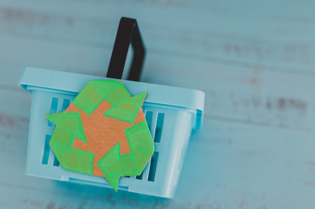 Shopping cart with recycling logo
