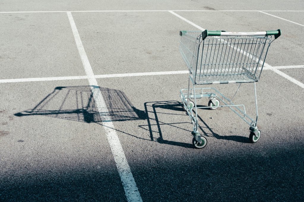 Stray shopping cart in a parking lot
